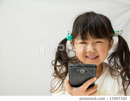 A smartphone and a girl A smartphone and a girl 13997380