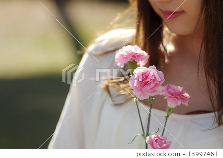 A woman with carnation 13997461