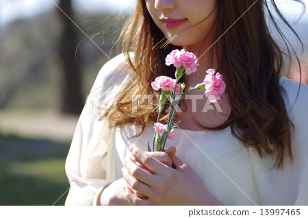A woman with carnation 13997465