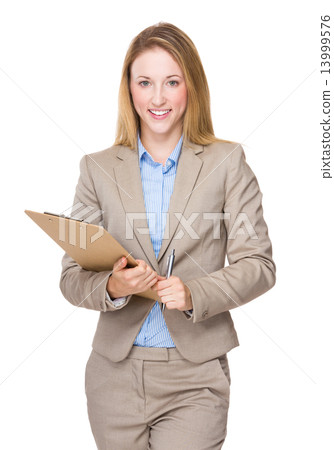 Businesswoman with clipboard 13999576