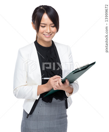 Businesswoman write on clipboard Businesswoman write on clipboard 13999672