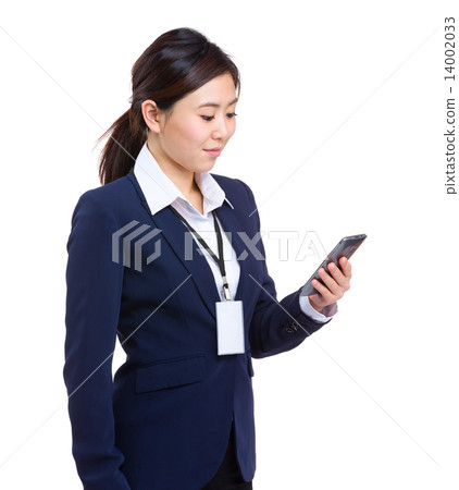 Businesswoman look at cellphone Businesswoman look at cellphone 14002033