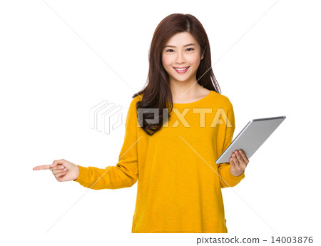 Woman use of tablet and finger point aside Woman use of tablet and finger point aside 14003876