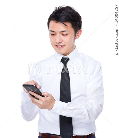 Businessman look at cellphone Businessman look at cellphone 14004257