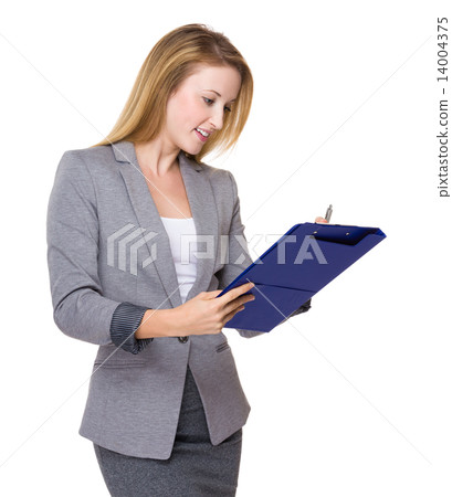 Businesswoman write on clipboard Businesswoman write on clipboard 14004375