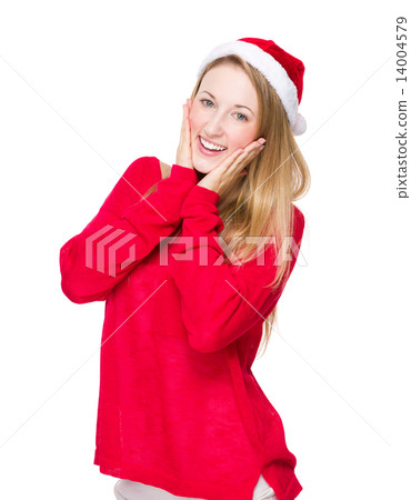 Happy woman with santa hat and hand on face Happy woman with santa hat and hand on face 14004579