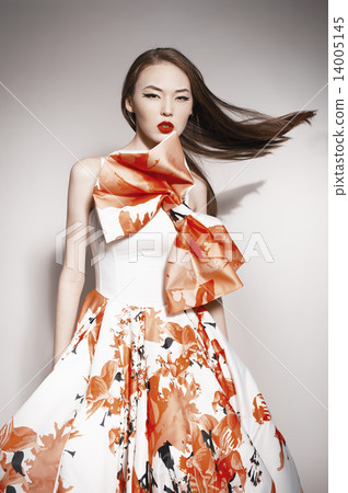young beautiful asian brunette in gorgeous dress, motion shot, f young beautiful asian brunette in gorgeous dress, motion shot, f 14005145