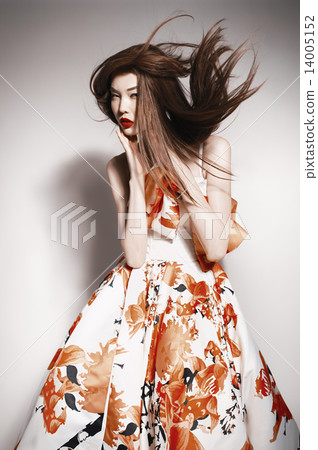 young beautiful asian brunette in gorgeous dress, motion shot young beautiful asian brunette in gorgeous dress, motion shot 14005152