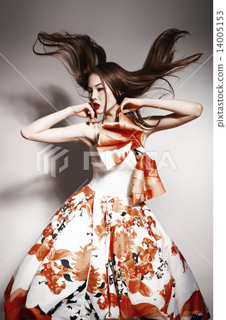 young beautiful asian brunette in gorgeous dress, motion shot young beautiful asian brunette in gorgeous dress, motion shot 14005153