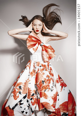 young beautiful asian brunette in gorgeous dress, motion shot young beautiful asian brunette in gorgeous dress, motion shot 14005157