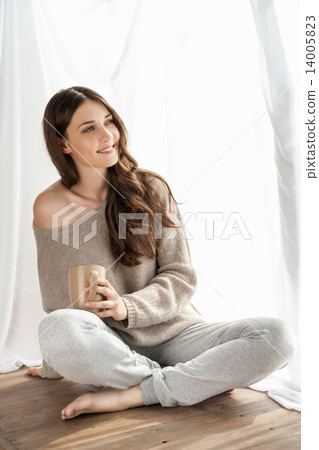 Beautifulgirl with cup enjoying new day  14005823