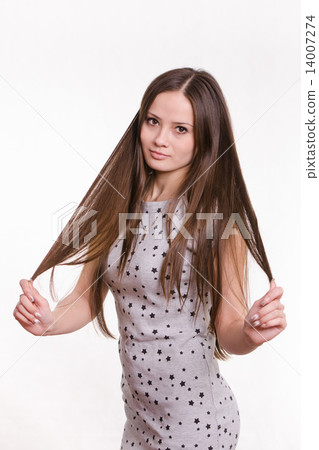 Girl holding her hair Girl holding her hair 14007274