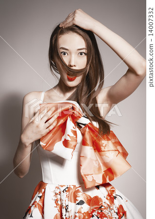 shocked young beautiful asian brunette in gorgeous dress. funny 14007332