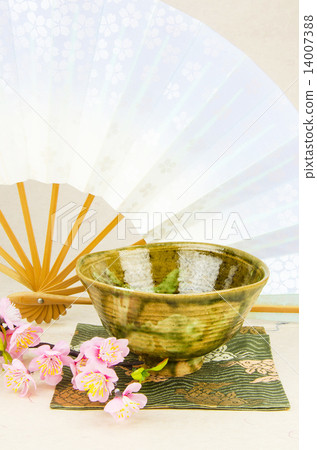 Matcha tea bowl, folding fan and cherry blossoms 14007388
