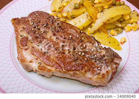 Juicy pork steak and homemade fries 14009840