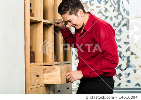 Korean man shopping cabinet in furniture store Korean man shopping cabinet in furniture store 14010894