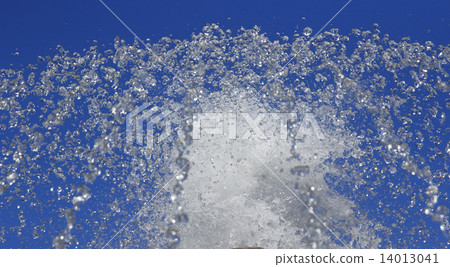 Fountain drops of pure water against a blue sky. Fountain drops of pure water against a blue sky. 14013041