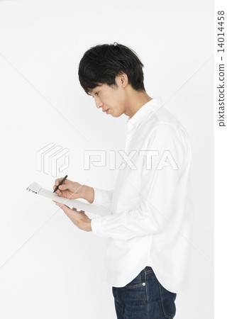 A young man with a white shirt to write something A young man with a white shirt to write something 14014458