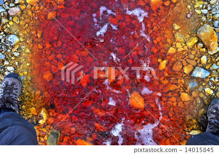 Red polluted water stream in Geamana, Romania 14015845