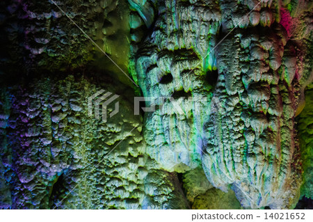 Colorfully lit stone formations in cave at guilin Colorfully lit stone formations in cave at guilin 14021652