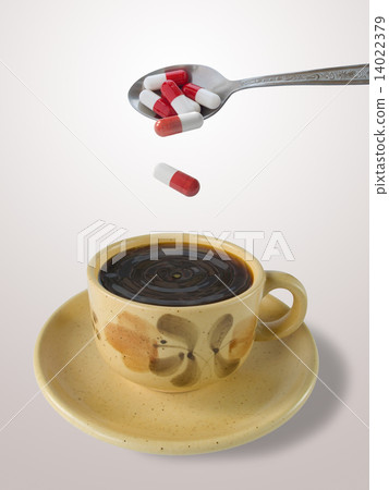 Cup of coffee and spoon with pills 14022379