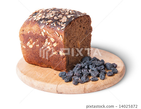 Unleavened bread with seeds on wooden board with raisins 14025872