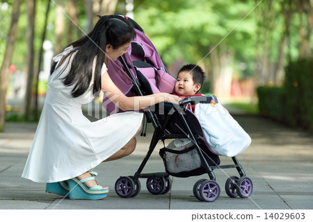 Chinese mother with baby in a stroller Chinese mother with baby in a stroller 14029603
