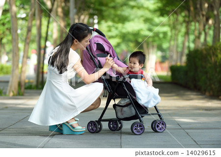 Chinese mother with baby in a stroller 14029615