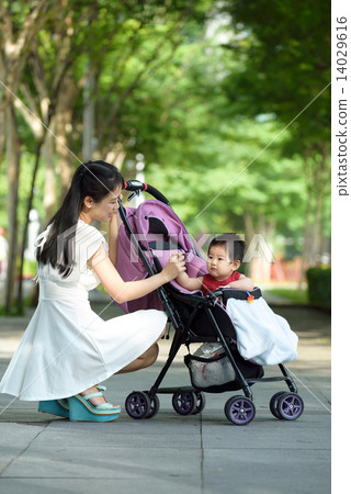 Chinese mother with baby in a stroller 14029616