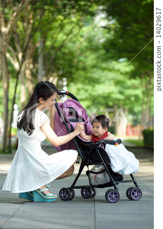 Chinese mother with baby in a stroller 14029617