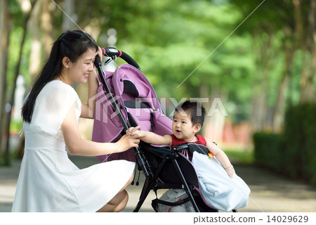 Chinese mother with baby in a stroller 14029629