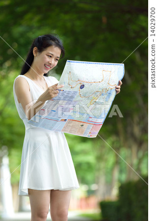 One chinese woman sightseeing along promenade One chinese woman sightseeing along promenade 14029700