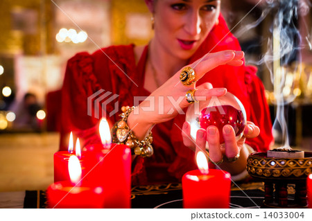 Soothsayer in Seance with Crystal ball and smoke 14033004