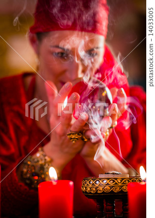 Soothsayer in Seance with Crystal ball and smoke 14033005