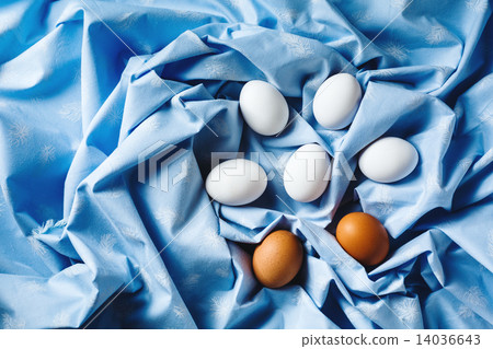 Easter eggs on blue textile draped background 14036643