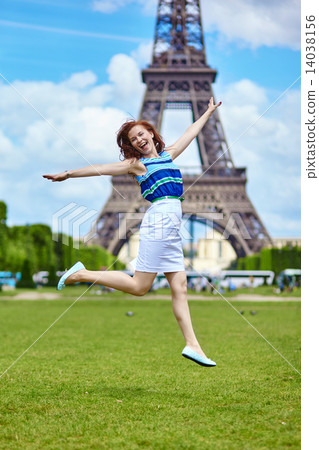 Girl jumping near the Eiffel Tower in Paris Girl jumping near the Eiffel Tower in Paris 14038156