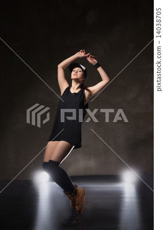 Sexy young woman in a trendy clothes over black background 14038705