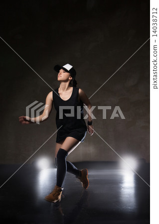 Sexy young woman in a trendy clothes over black background 14038712