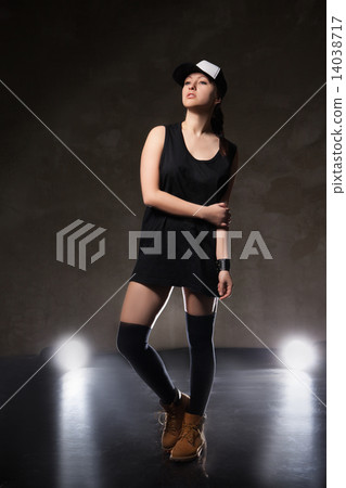 Sexy young woman in a trendy clothes over black background 14038717