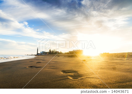 Sunset on the beach. The footprints. Sunset on the beach. The footprints. 14043671