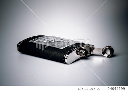 Stainless hip flask isolated on white background Stainless hip flask isolated on white background 14044699