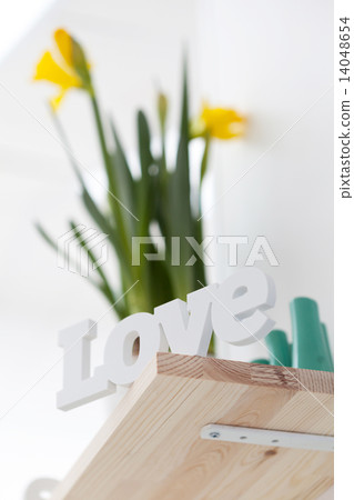 Romantic love sign on a shelf with flowers Romantic love sign on a shelf with flowers 14048654