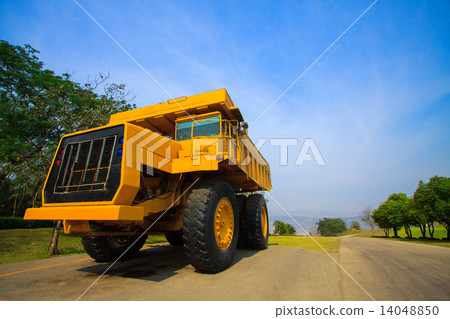 Heavy mining truck in mine and driving along the opencast. Photo of the big mine truck, The career h Heavy mining truck in mine and driving along the opencast. Photo of the big mine truck, The career h 14048850