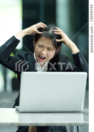 Chinese businesswoman having a bad day at work Chinese businesswoman having a bad day at work 14049344