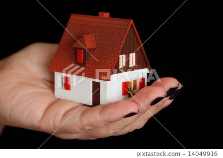 Dollhouse in human hand 14049916