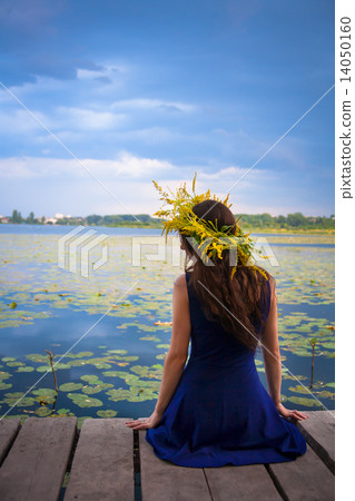 girl by the lake with a wreath on head girl by the lake with a wreath on head 14050160