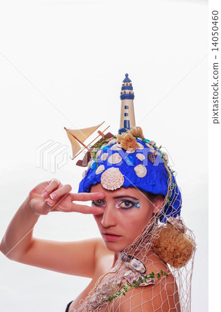 Woman wearing a nautical themed headdress 14050460