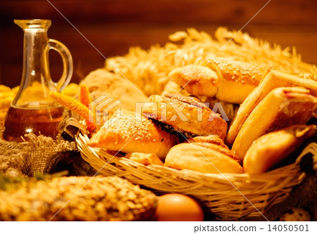Basket with homemade baked goods on a table Basket with homemade baked goods on a table 14050501