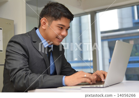 Asian business man using laptop computer in the office 14056266