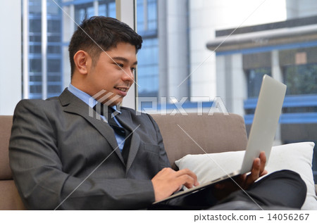 Asian business man using laptop computer in the office 14056267